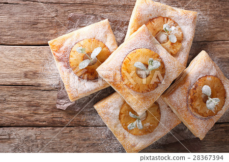 Freshly baked puff pastry pies with pineapple 28367394