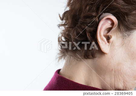 Senior women playing hearing aids 28369405