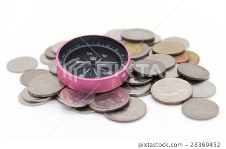 compass and coins on white background 28369452