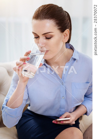 Attractive self employed woman having water 28370072