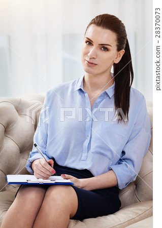 Beautiful positive woman holding her notes 28370073