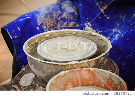 The potter molds clay jug pot closeup 28370753