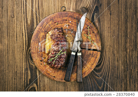 steak on the old cutting board 28370840