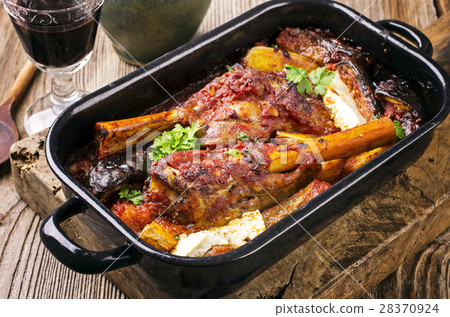 lamb knuckls braised in tomato sauce lamb knuckls braised in tomato sauce 28370924