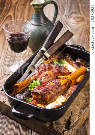 lamb knuckls braised in tomato sauce lamb knuckls braised in tomato sauce 28370925
