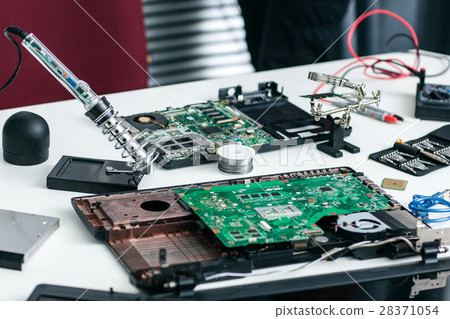 Electronic repairman workplace with components 28371054