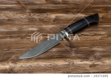Hunting steel knife handmade on a wooden Hunting steel knife handmade on a wooden 28371895