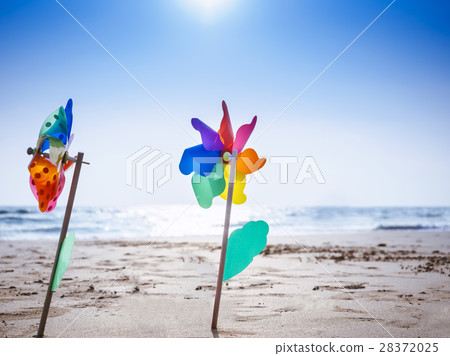 Pinwheel on sand Beach Outdoor Summer holiday Pinwheel on sand Beach Outdoor Summer holiday 28372025