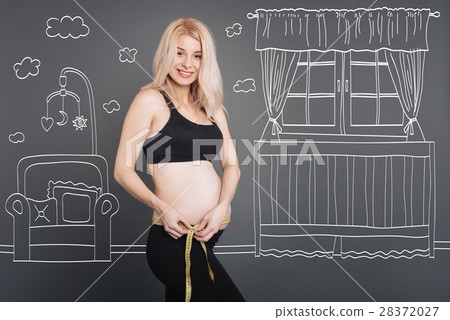 Positive pregnant woman resting at home 28372027