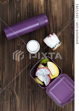 Vertical photo of violet thermos lying on the 28372261