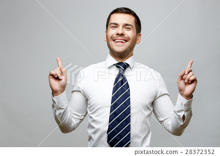 Handsome stylish businessman on grey background Handsome stylish businessman on grey background 28372352