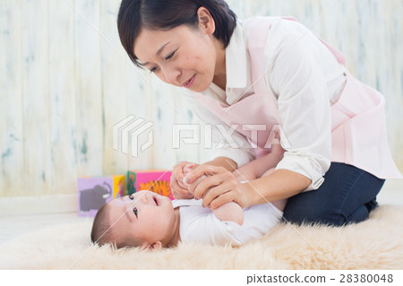 woman cradling a baby 28380048