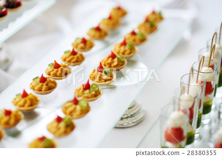 Plates with assorted snacks on an event party 28380355