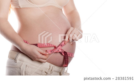 Pregnant woman measuring belly Pregnant woman measuring belly 28381591