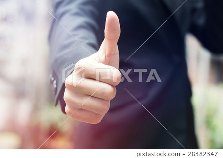 Businessman shows thumb up Businessman shows thumb up 28382347