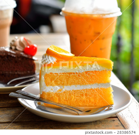 Orange cake and cold drink 28386574