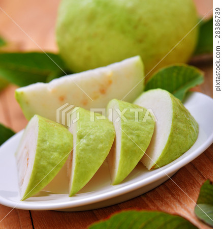 Fresh guava fruit on wooden background Fresh guava fruit on wooden background 28386789