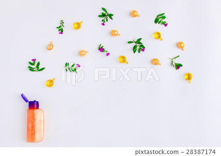 Bottle of oil meadow flowers, white Flat lay, top Bottle of oil meadow flowers, white Flat lay, top 28387174