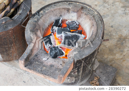 charcoal burning clay stove in a rustic wooden charcoal burning clay stove in a rustic wooden 28390272