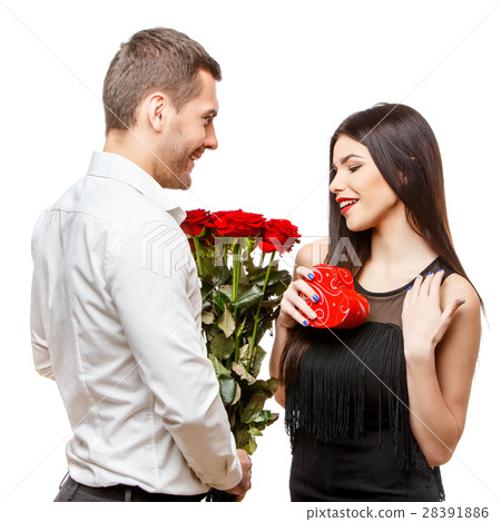 Young beautiful couple with present isolated on 28391886