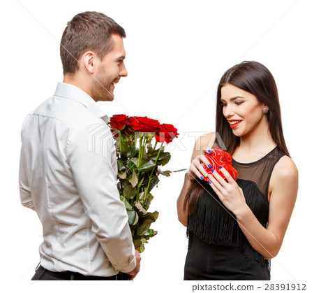 Young beautiful couple with present isolated on 28391912