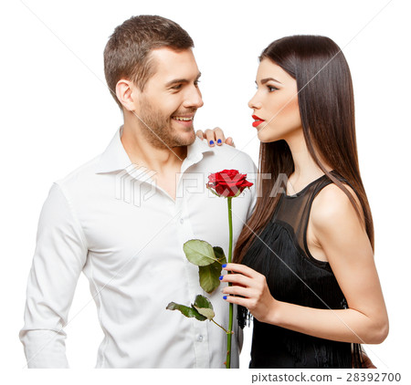 Young beautiful couple with flowers isolated on 28392700