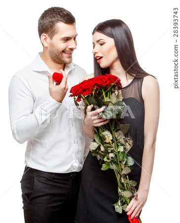 Young beautiful couple with present isolated on 28393743