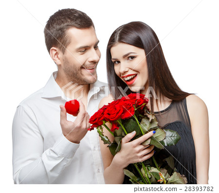 Young beautiful couple with present isolated on 28393782