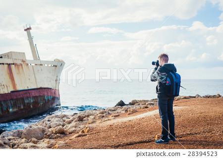 Young photographer on the beach Young photographer on the beach 28394523