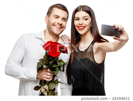 Young beautiful couple with flowers isolated on 28394631