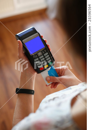 Hand putting plastic card into credit card 28396564