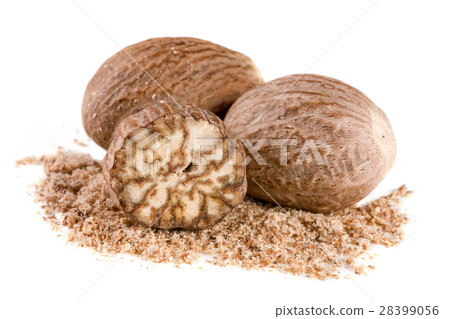 Three nutmeg and powder isolated on white Three nutmeg and powder isolated on white 28399056