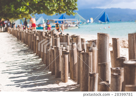 Bamboo sticks on the beach with white sand Bamboo sticks on the beach with white sand 28399781