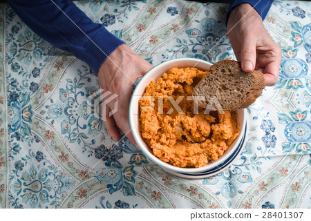 Eating hummus on the patterns background Eating hummus on the patterns background 28401307