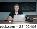 student is preparing for a lecture in classroom 28402406