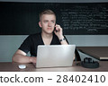 student is preparing for a lecture in classroom 28402410