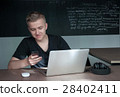 student is preparing for a lecture in classroom 28402411
