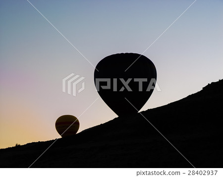 hot air balloons flying over the Cappadocia valley 28402937