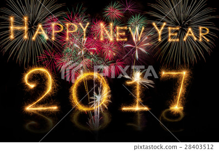 Happy new year 2017 written with Sparkle firework on fireworks with dark background, celebration and greeting cards concept 28403512