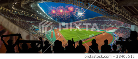 The silhouette of fan club over the panorama of Abstract blurred photo of fan sport at stadium with firework, sport background concept 28403515