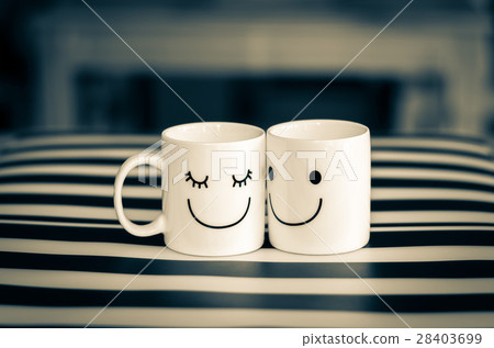 Two happy cups on the table, about love concept Two happy cups on the table, about love concept 28403699