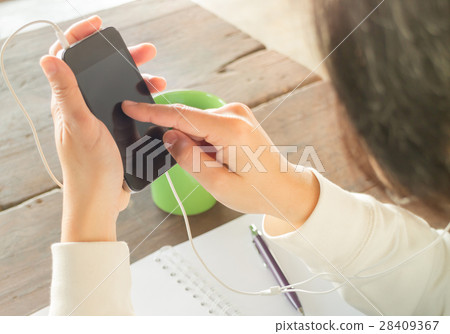 Woman wear headphones surfing the net 28409367