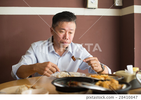 asian matured male eating bah kut teh 28410847