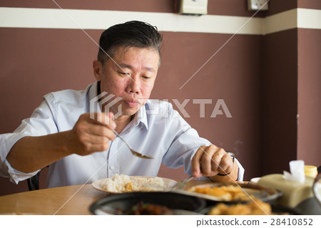 asian matured male eating bah kut teh 28410852
