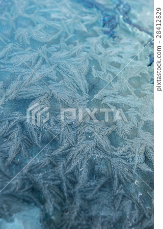 Snowflake on the window of the car 28412829