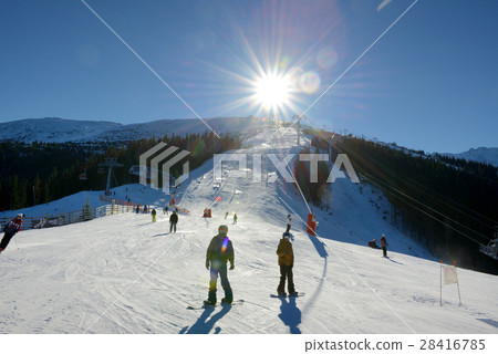 The skiers, snowborders and cableway in Jasna The skiers, snowborders and cableway in Jasna 28416785