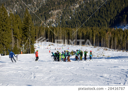 The skiers school training is on slope The skiers school training is on slope 28416787