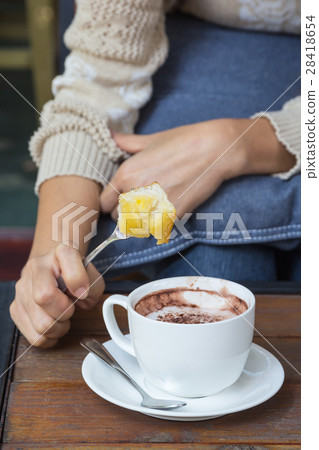 a cup of hot chocolate and sliced toast bread. a cup of hot chocolate and sliced toast bread. 28418654