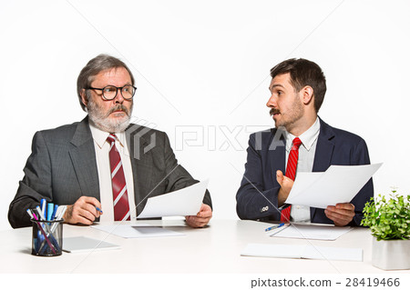 The two colleagues working together at office on The two colleagues working together at office on 28419466