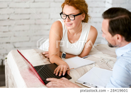 Decent middle aged couple working on the project 28419601